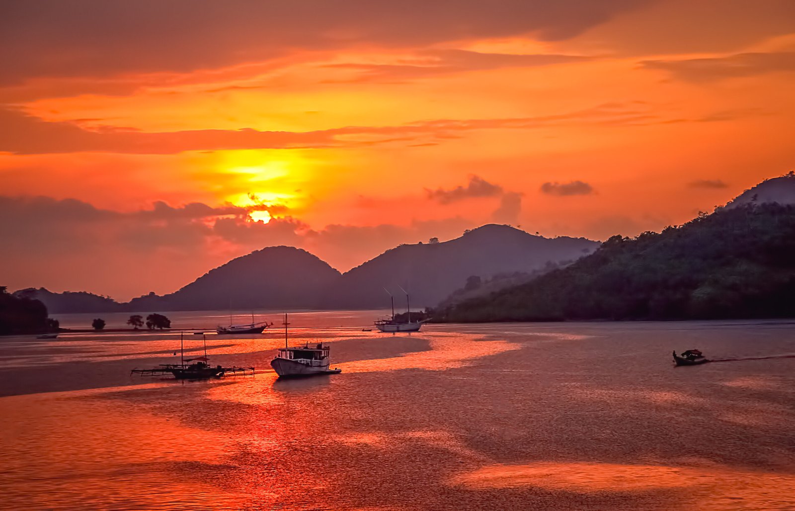 Sunset over bay in Labuan Bajo town on the Flores island, Indonesia